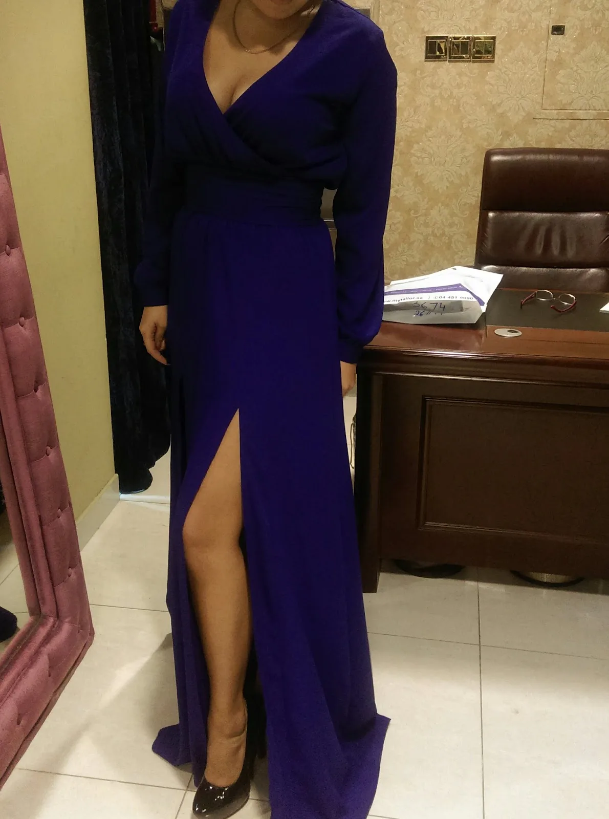 Client in a royal-blue evening gown with a high slit