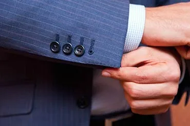 Close-up of working cuff buttons on a tailored sleeve