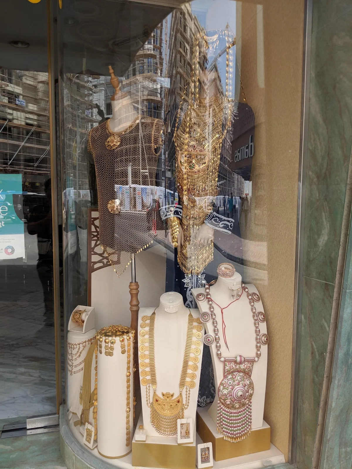 Bridal gold sets displayed in the showroom window