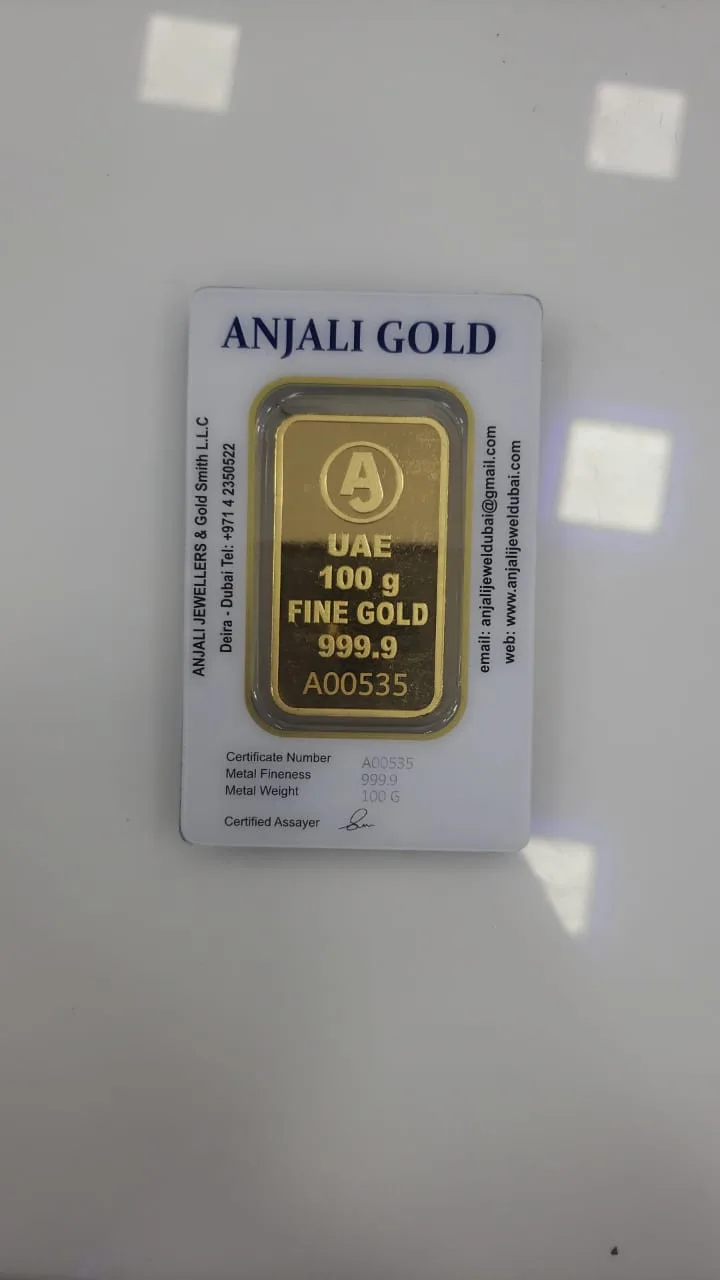 Anjali Gold 100 gram fine gold bar in a sealed certificate card, 999.9 fine