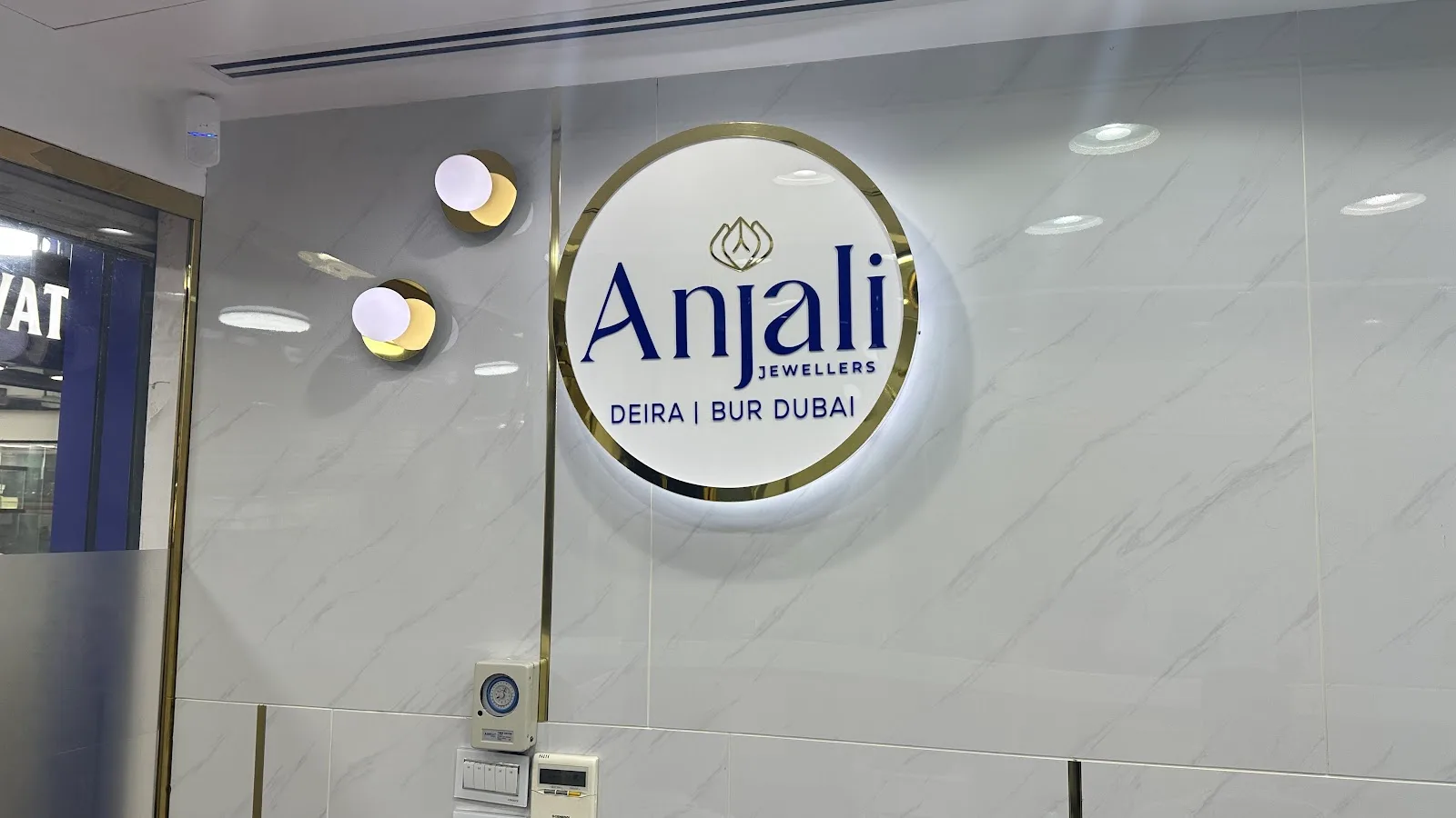 Anjali Jewellers Deira Bur Dubai illuminated sign on a marble wall