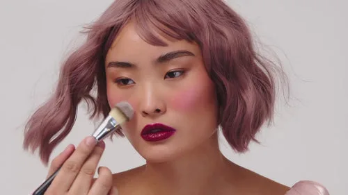 Makeup being applied to a model