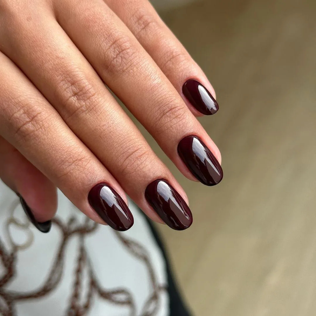 Glossy dark-red manicure