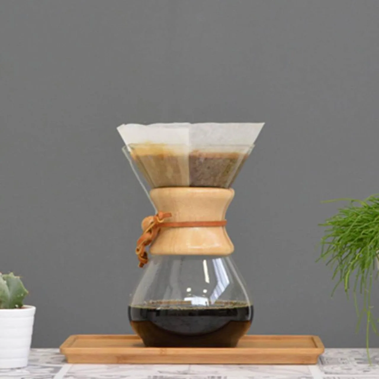 A Chemex pour-over brewer with fresh coffee