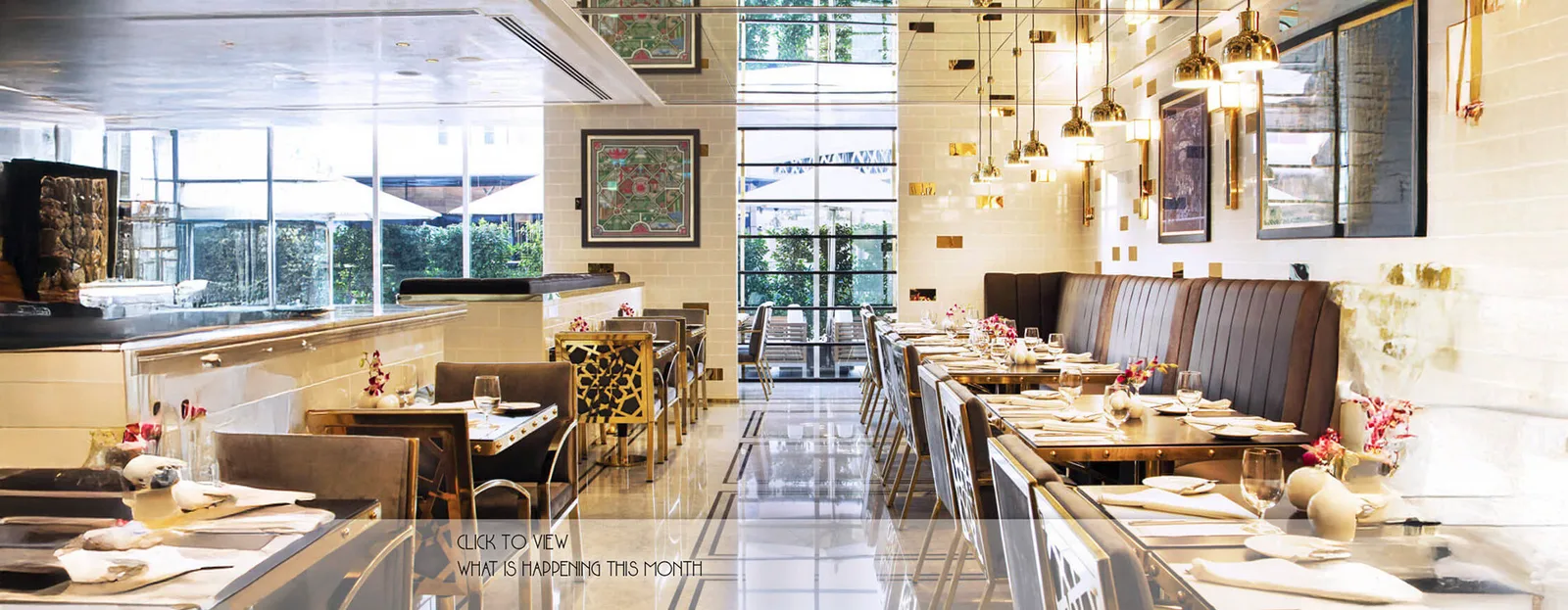 Café Society dining room with gold pendants