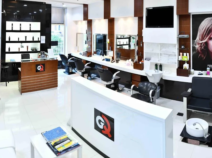 Inside GQ Men's Hair Lounge in JLT — styling chairs, mirrors and product display