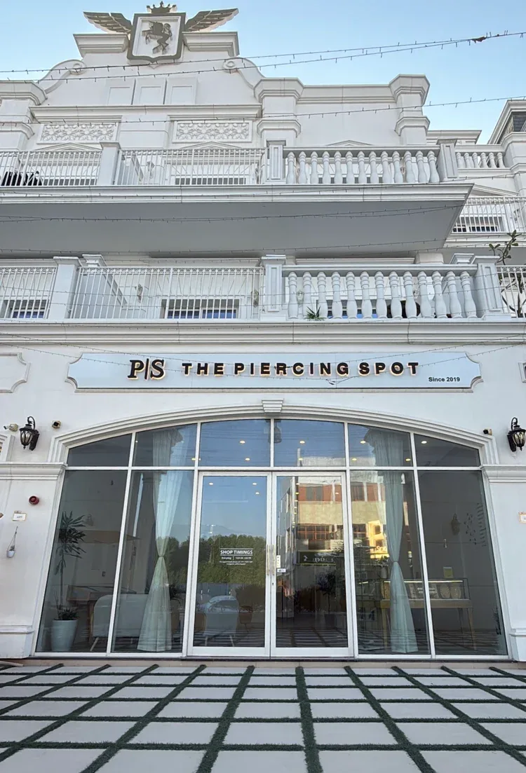 Exterior of the white building housing The Piercing Spot, marked 'Since 2019'