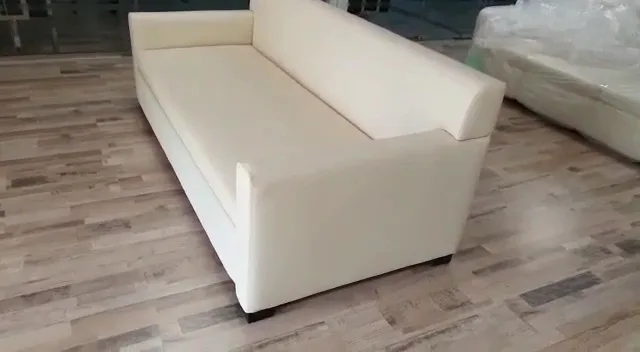 Cream bespoke sofa being finished in the Risala workshop