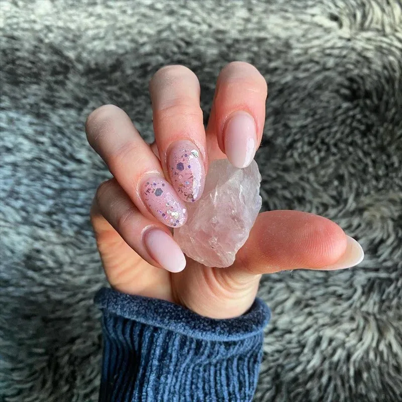 Nude and glitter almond nails
