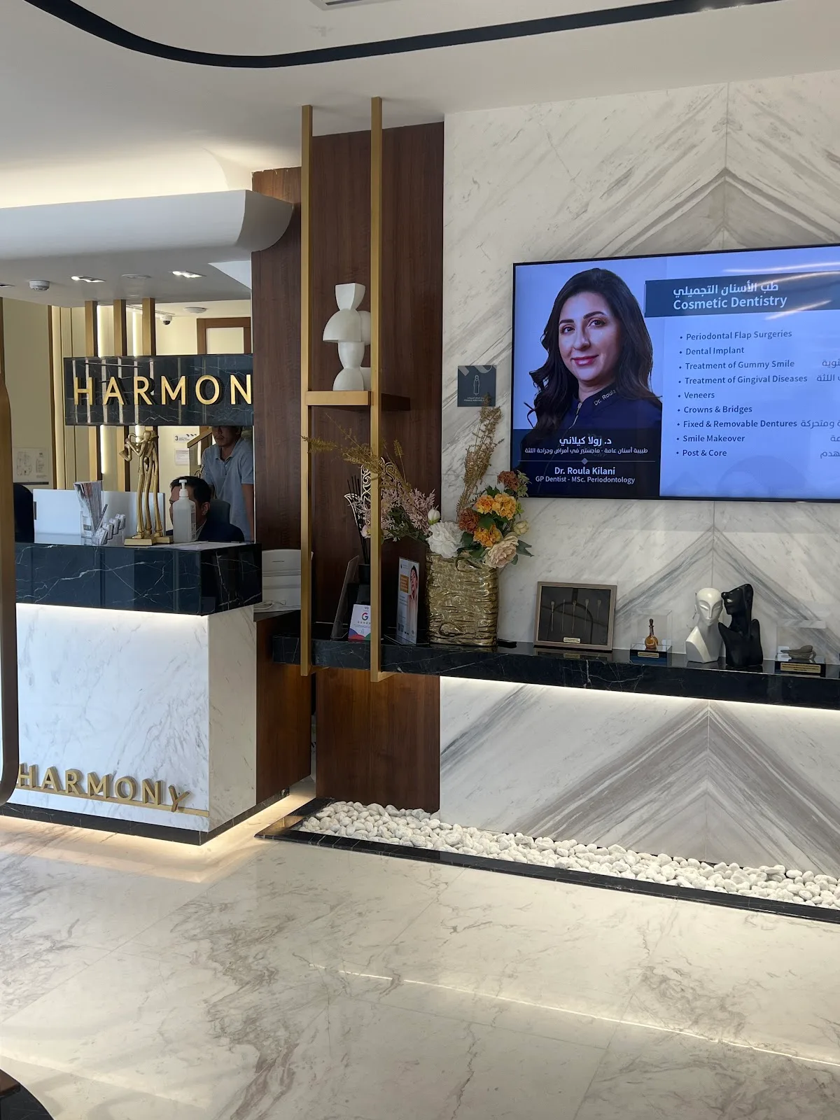 Reception area with marble walls and information screen