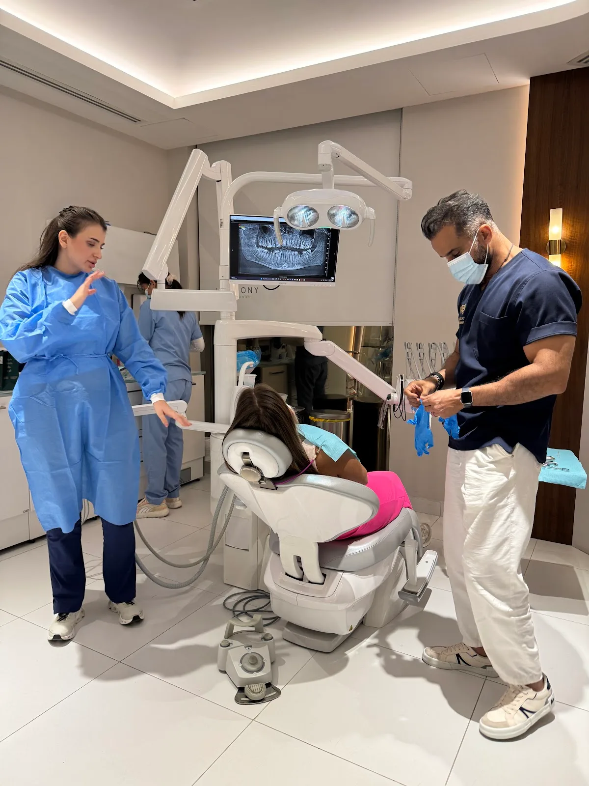 Clinical team preparing for a treatment in the operatory