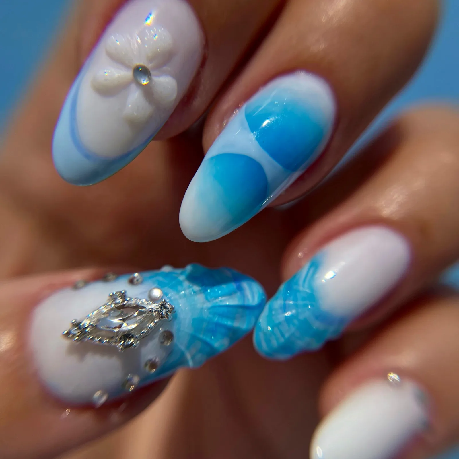 Blue and white nail art with crystals