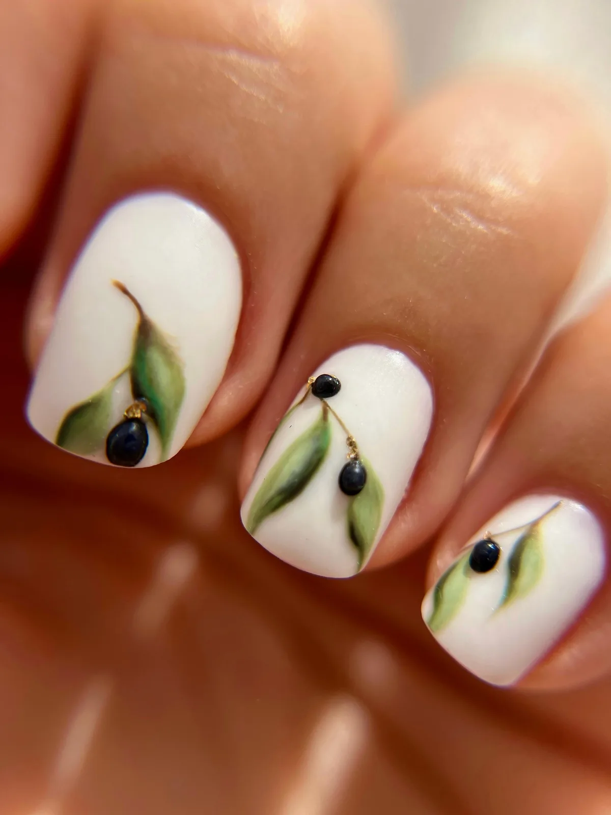 Minimal white nails with botanical detail