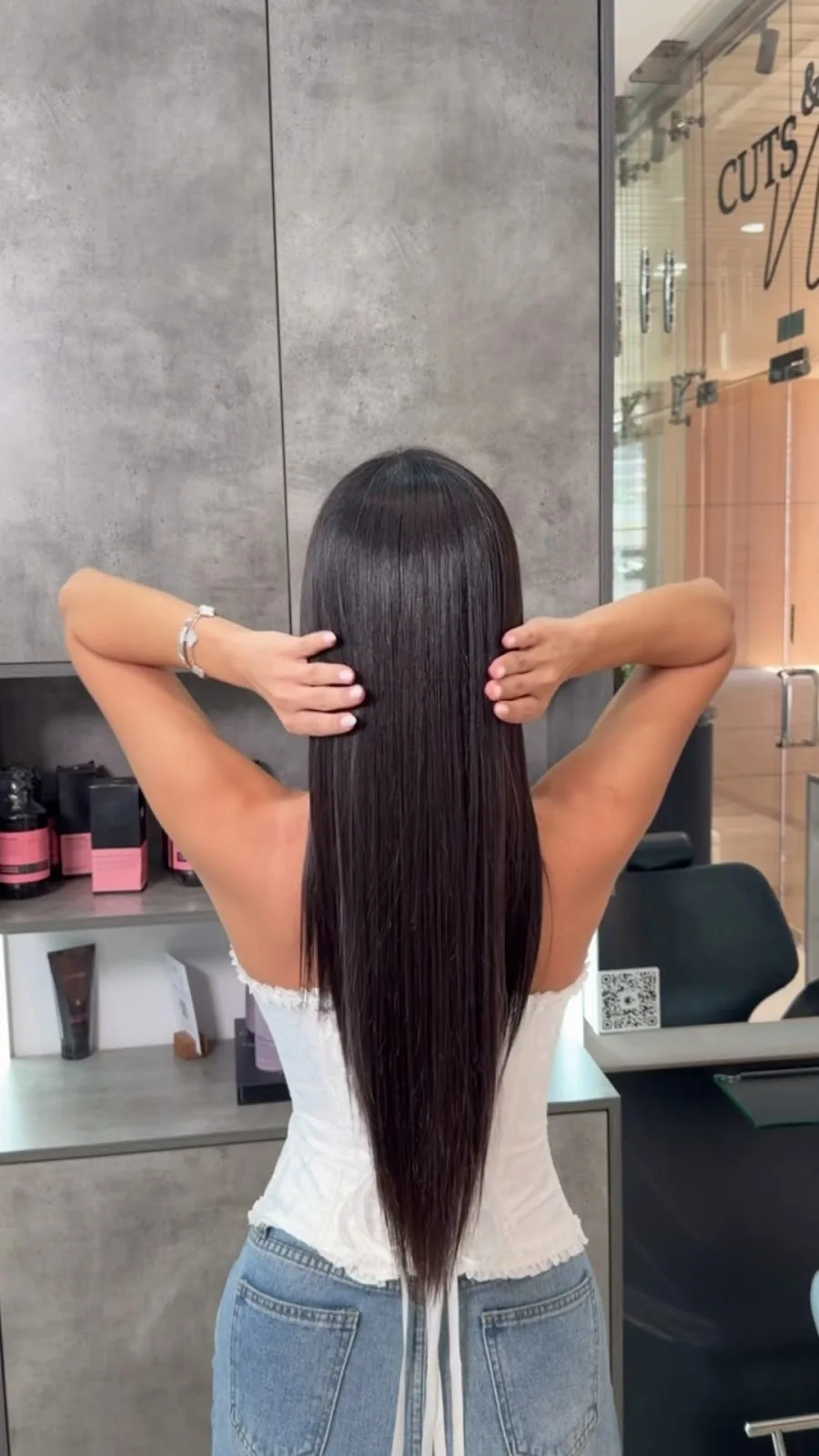 Long, sleek hair after treatment in the salon