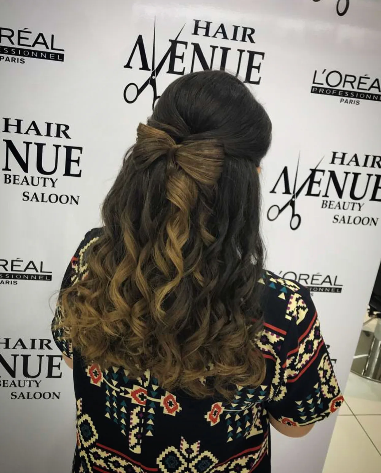 Styled curled hairstyle at Hair Avenue