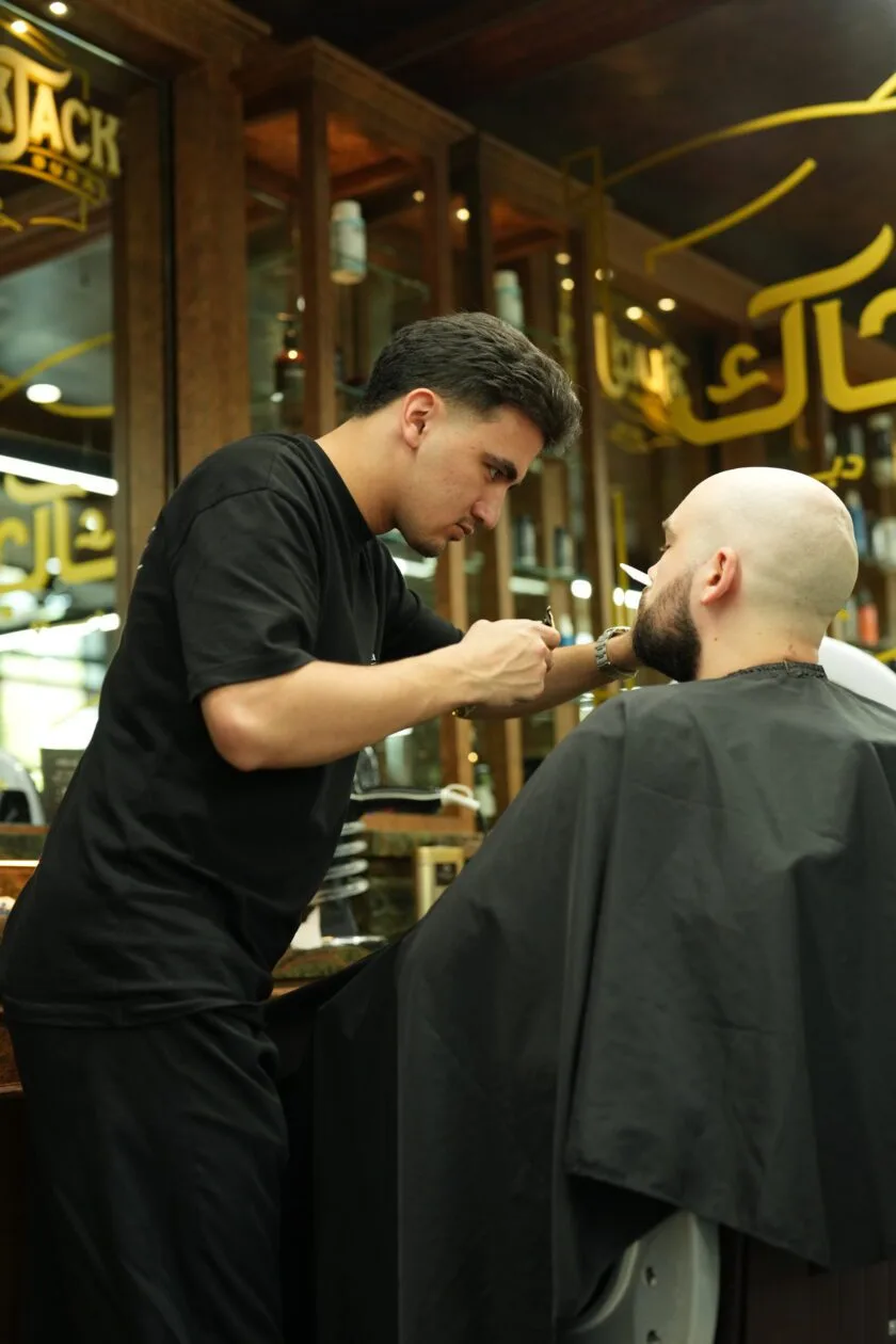 Traditional cut-throat razor shave in progress