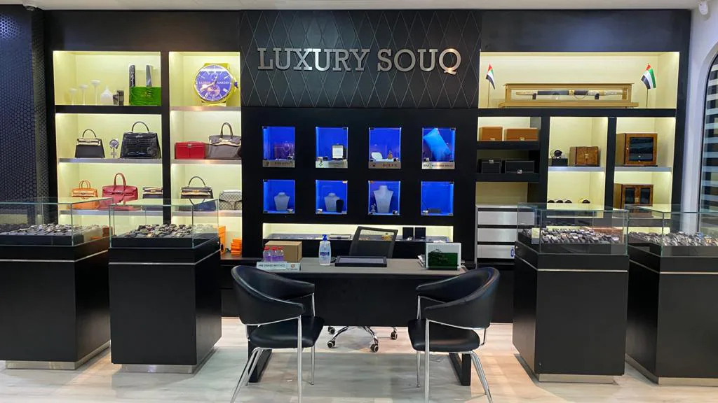 Interior of Luxury Souq boutique with display cabinets and consultation desk