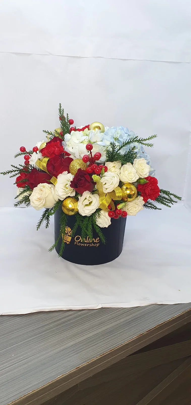 Festive red, white and gold arrangement in a black box