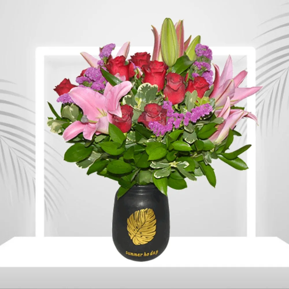 Red roses and pink lilies in a black vase