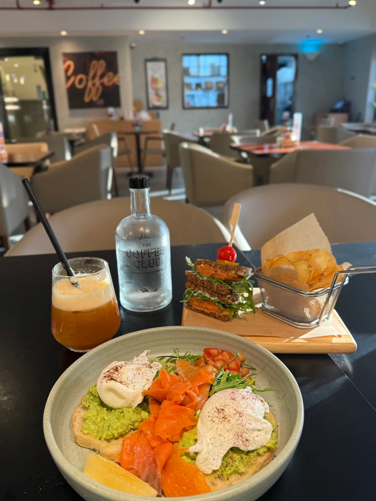 Smashed avocado and smoked salmon brunch plate with poached eggs