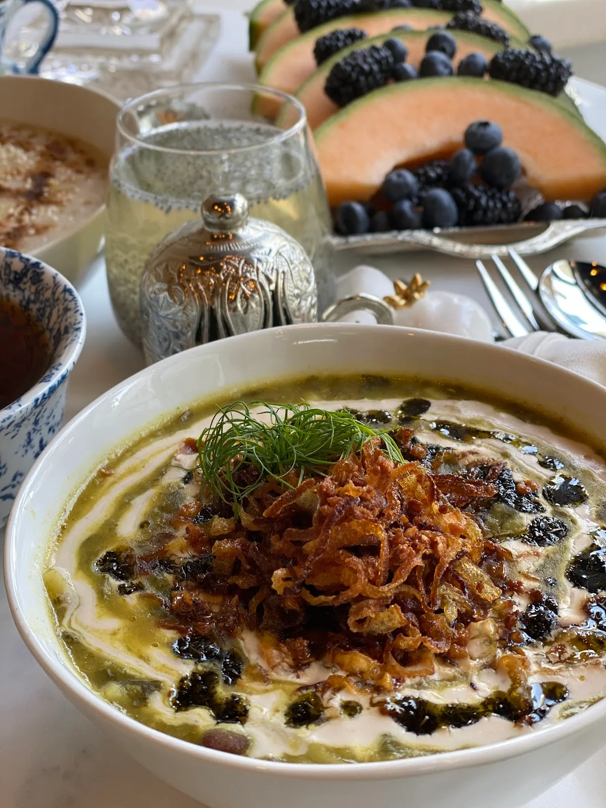 Persian ash reshteh soup topped with fried onions and herbs
