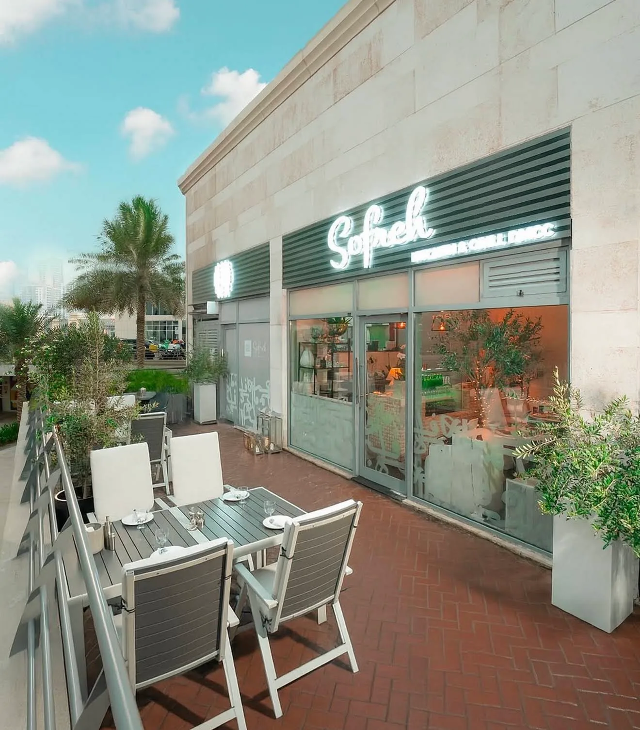Sofreh Kitchen & Grill storefront and outdoor terrace seating in Jumeirah Lakes Towers, Dubai
