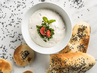 Yogurt dip with herbs and fresh bread