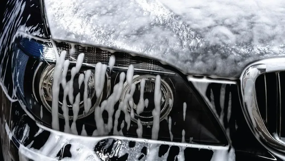 Foam wash on a vehicle headlight