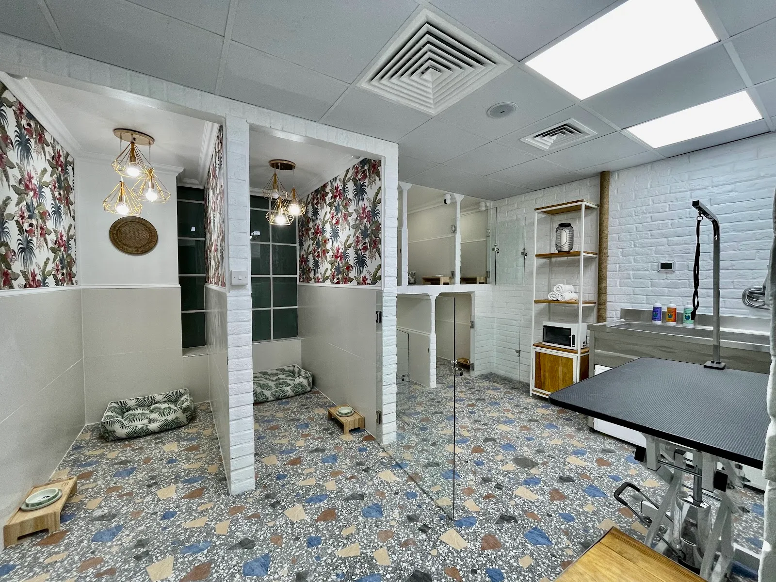 Bright spa grooming room with floral wallpaper and terrazzo floor