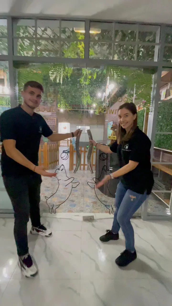 Two Pet Boutique team members welcoming guests at the entrance