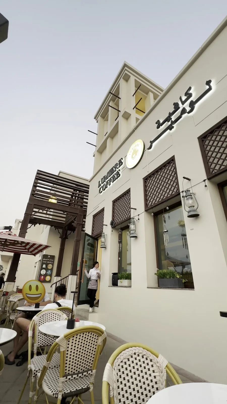 Lumière Coffee storefront with outdoor bistro seating beside the harbour