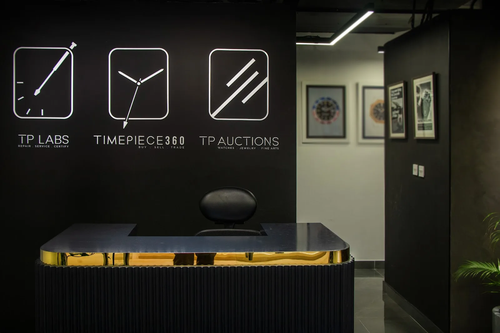 The Timepiece360 reception wall showing TP Labs, Timepiece360 and TP Auctions