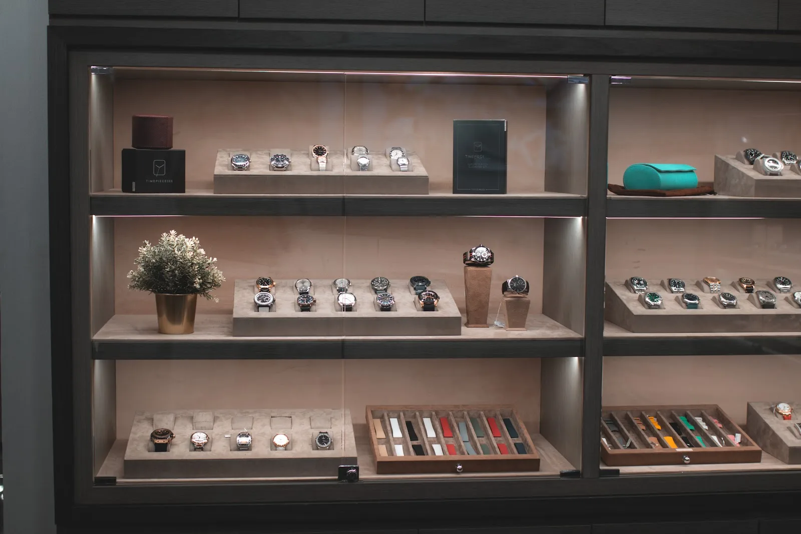 Watches and straps on lit showroom shelves