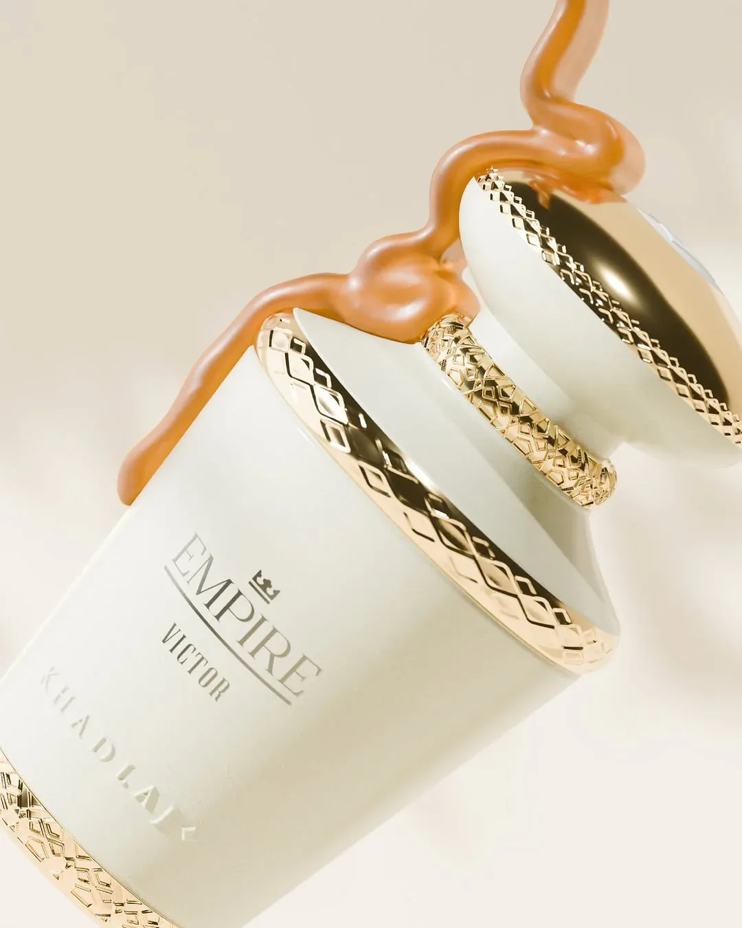 A Khadlaj perfume bottle styled with caramel