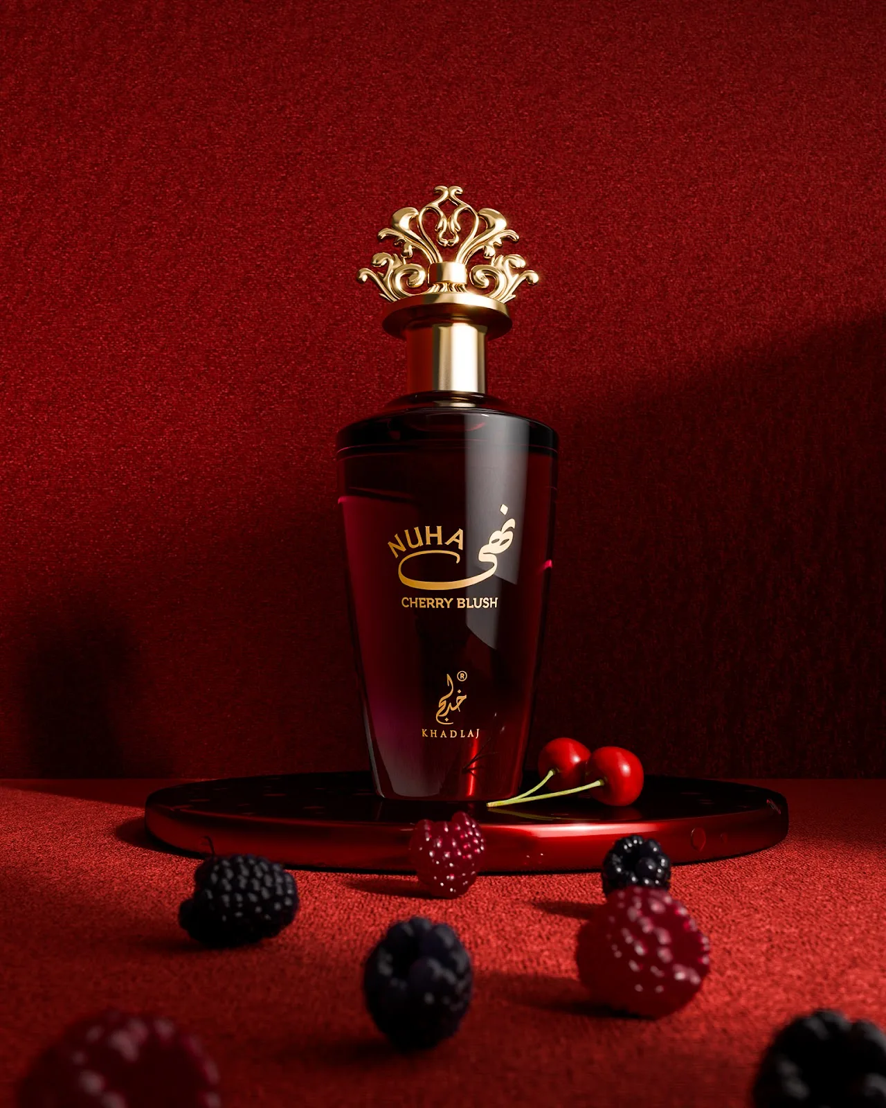 A deep red Khadlaj perfume bottle on red velvet