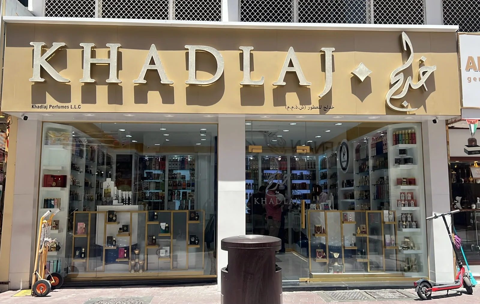 The Khadlaj Perfumes storefront in Deira with a large gold KHADLAJ sign over glass display windows