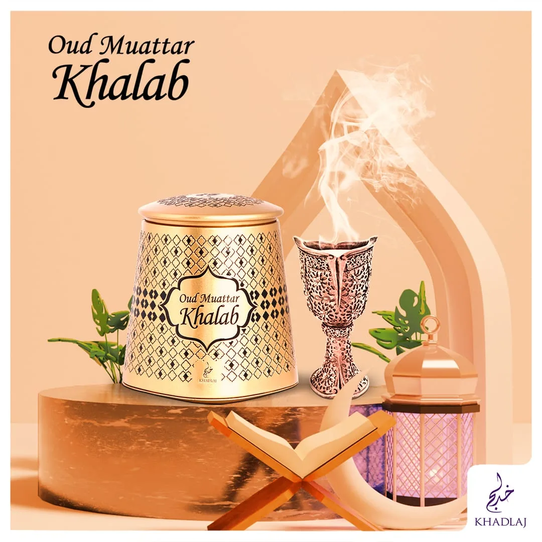 Khadlaj Oud Muattar Khalab — a gold bakhoor tin beside a burning incense holder
