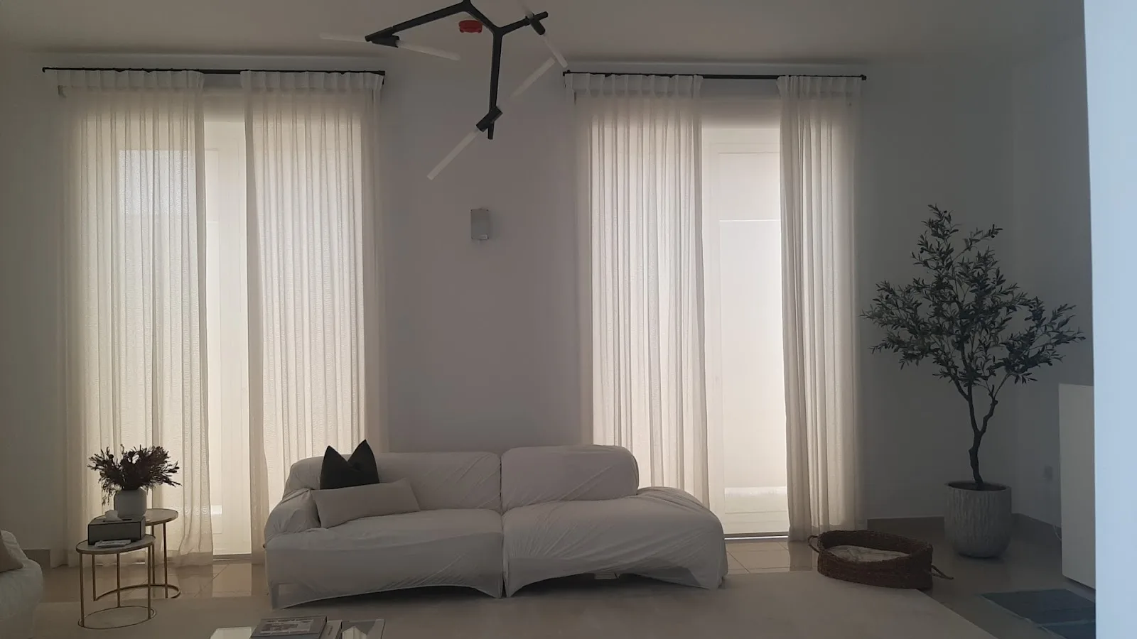 Living room with full-height white wave sheers