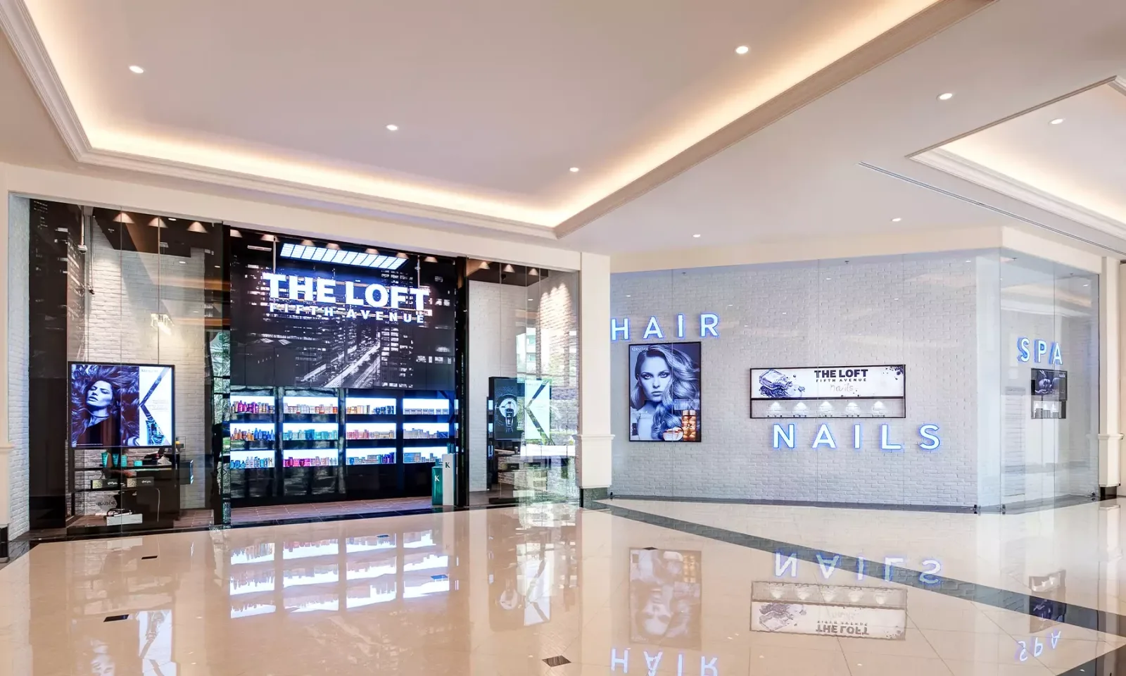The Loft Fifth Avenue storefront — white-brick HAIR, NAILS and SPA signage beside a black-glass entrance