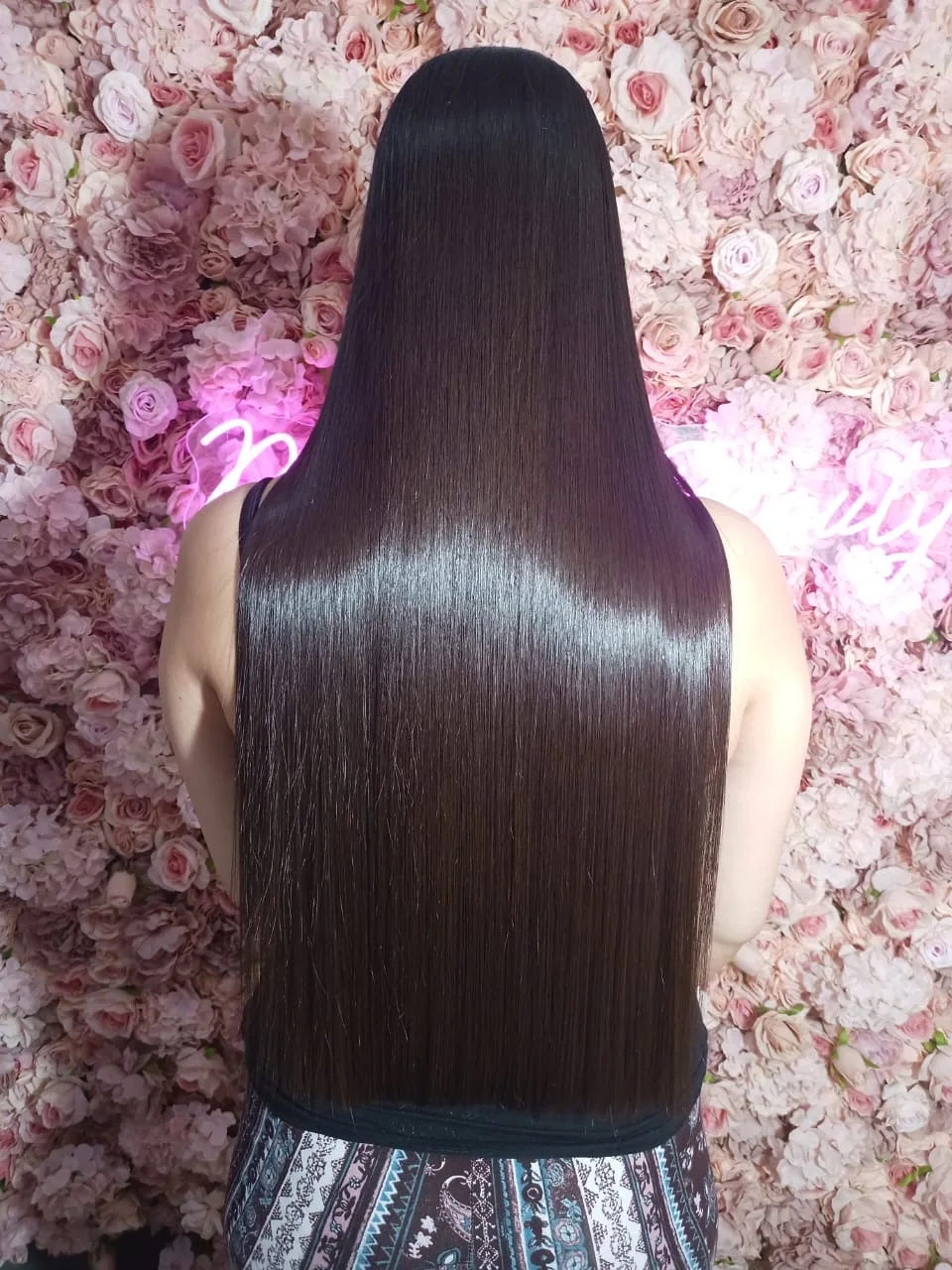 Long, sleek, glossy hair styled at the salon