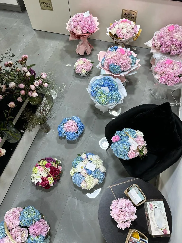 The Marina Flowers studio with fresh stems displayed in vases