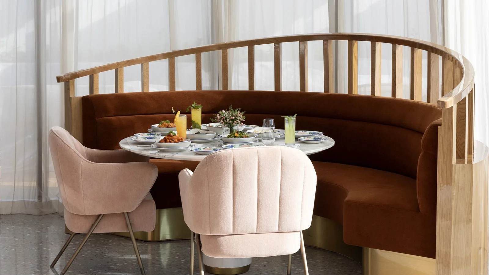 Table set for aperitivo with chilled bottles in a silver bucket