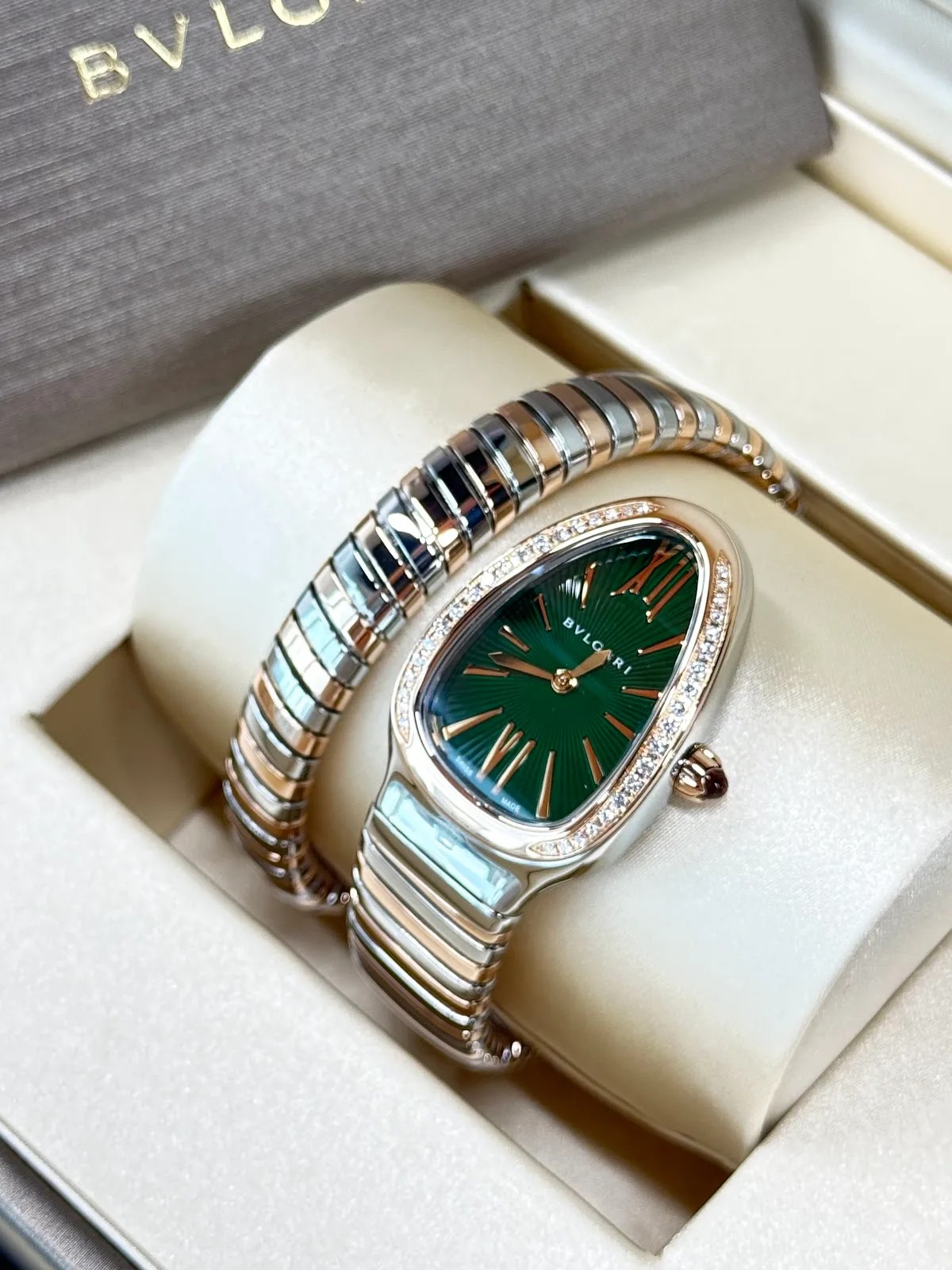 Bulgari Serpenti two-tone watch with a green dial and diamond bezel