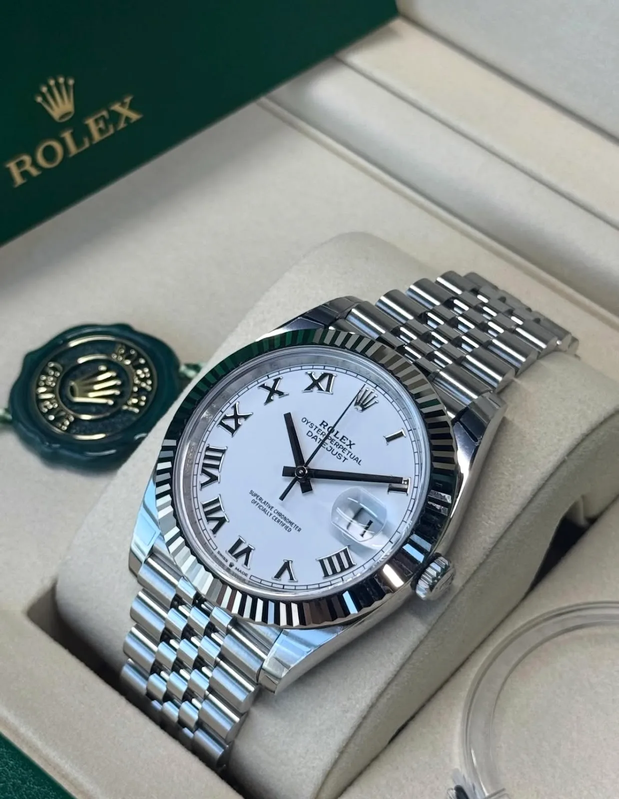Rolex Datejust with white Roman dial presented in its box