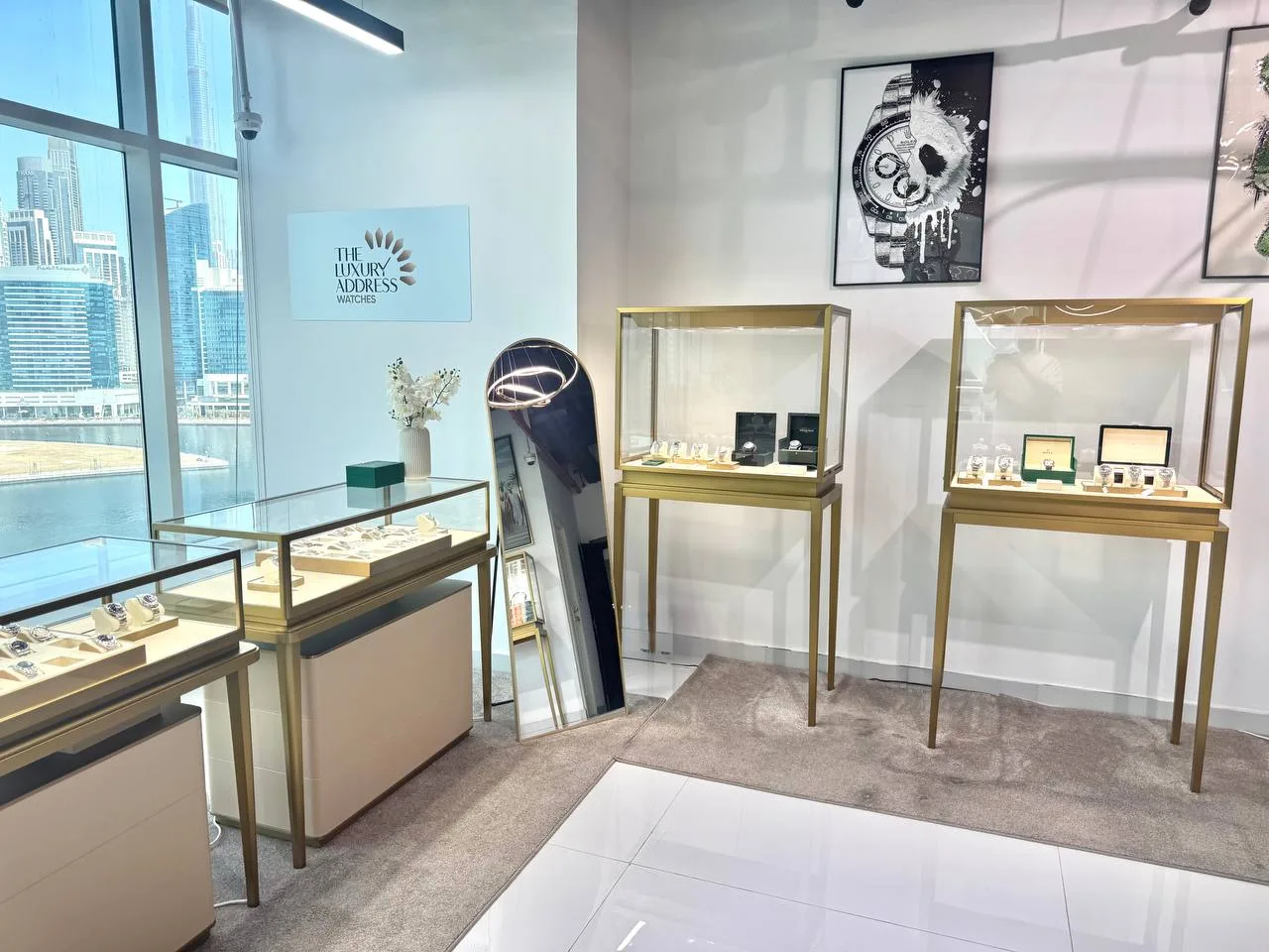 Gold-framed watch display cases inside the showroom