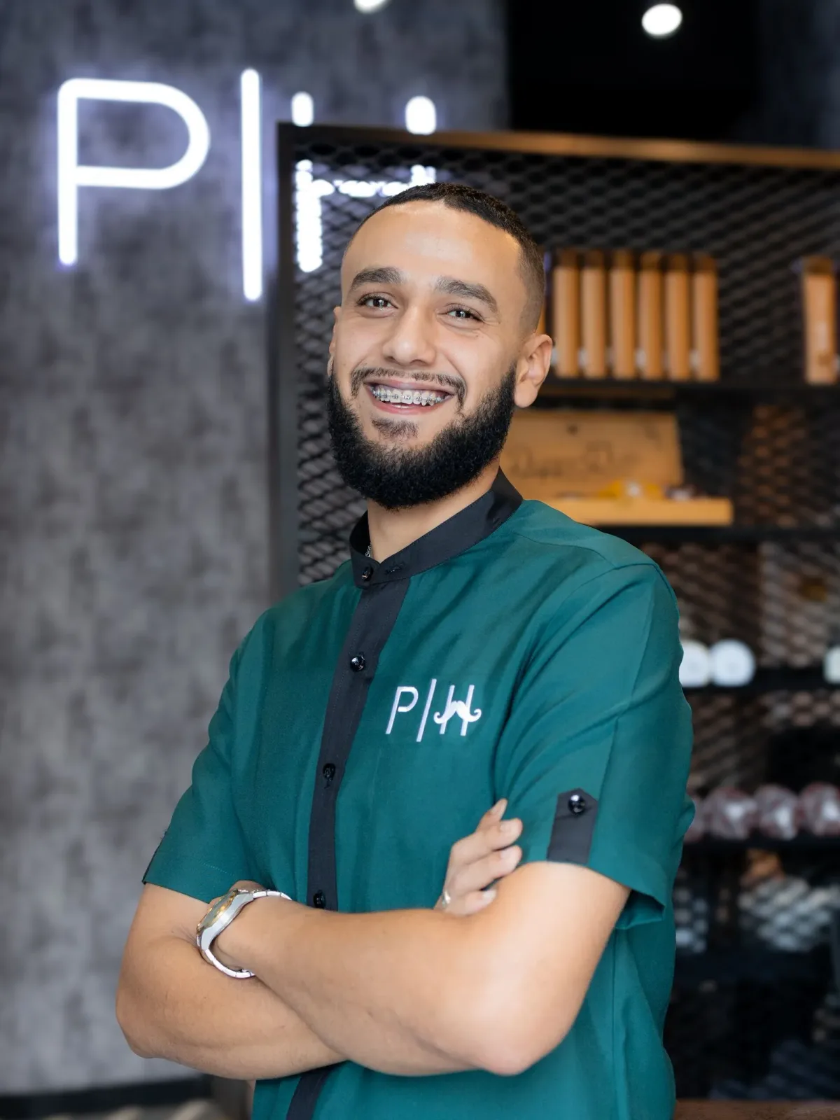 Project Hairway barber in green uniform