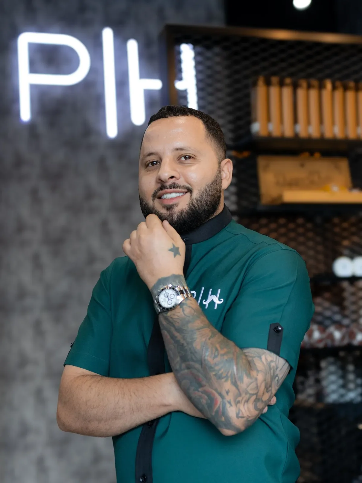 Project Hairway barber in green uniform