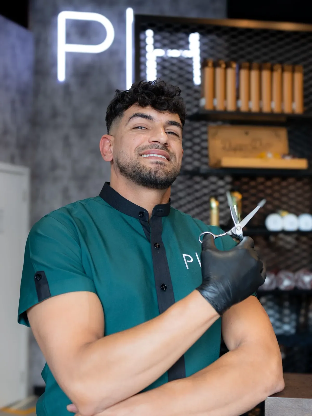 Project Hairway barber holding scissors