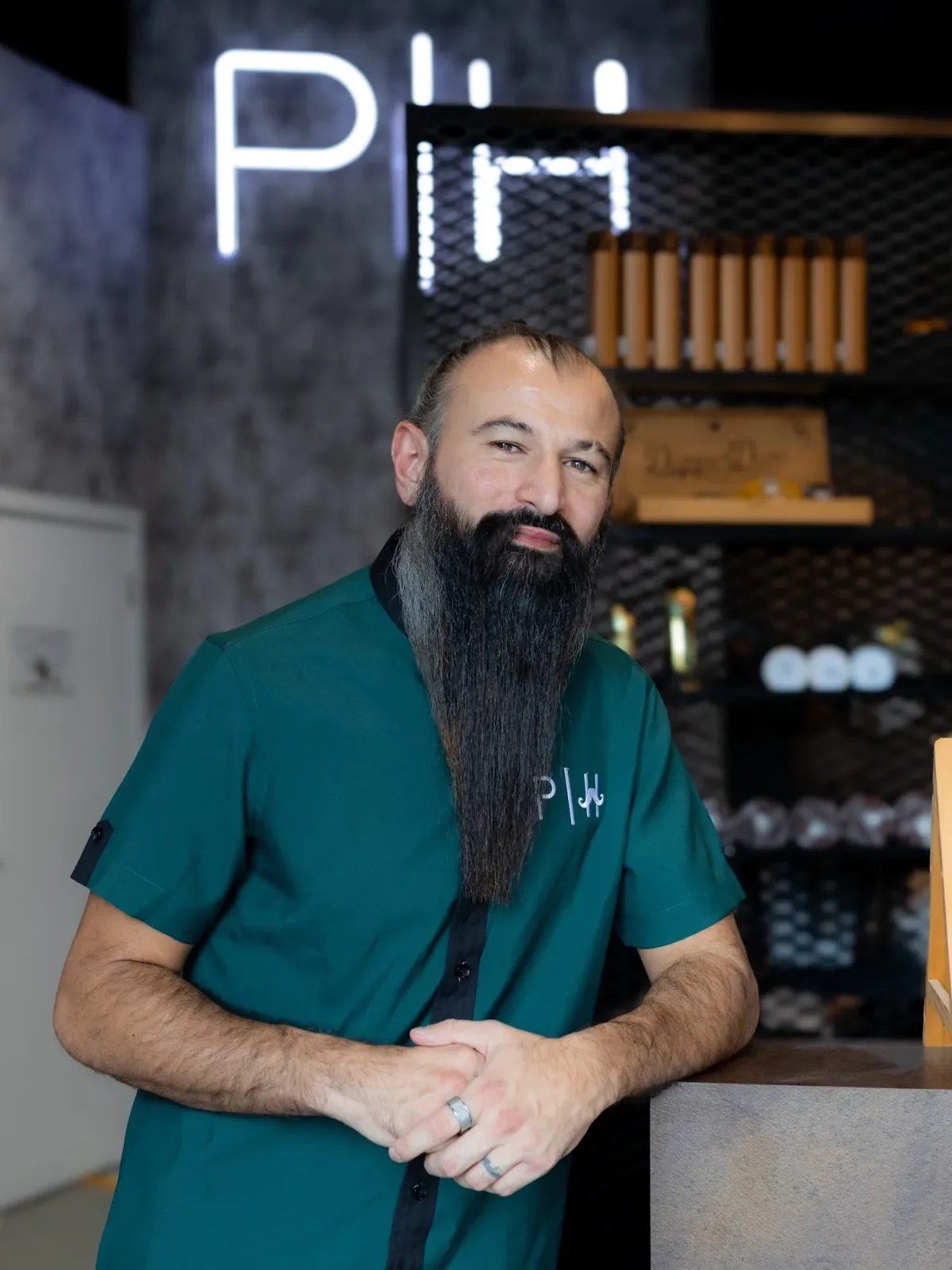Project Hairway barber in green uniform