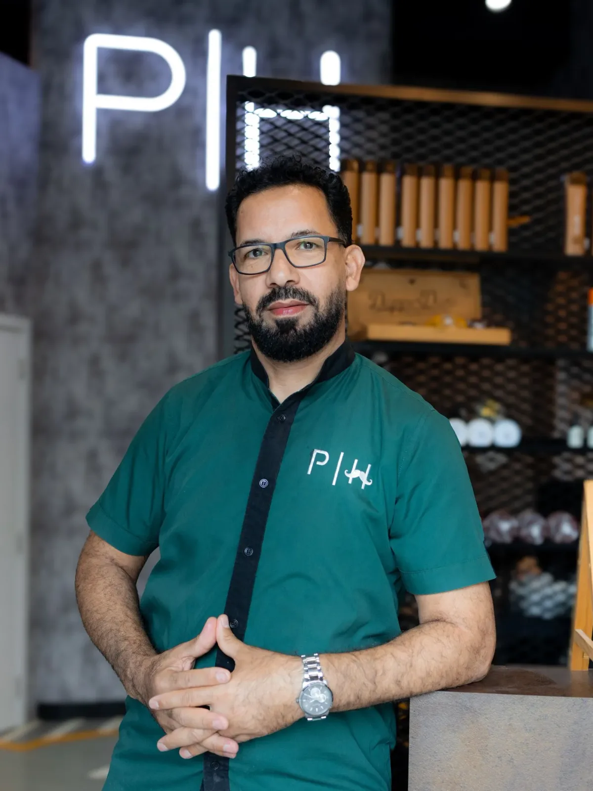 Project Hairway barber in green uniform